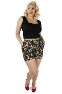 Model wearing leopard high waisted shorts 