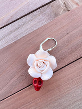Load image into Gallery viewer, Handmade Polymer Clay Ivory Rose and red Skulls Earrings