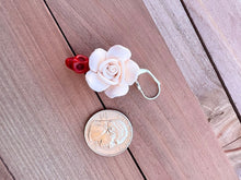 Load image into Gallery viewer, Handmade Polymer Clay Ivory Rose and red Skulls Earrings