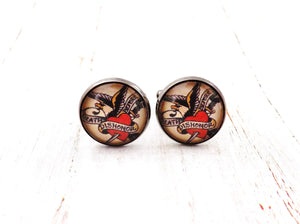Death Before Dishonor Pinup Rockabilly Men's Cufflinks. There cuffs feature the iconic tattoo art of "Sailor Jerry", Death Before Dishonor. Nickle and Lead Free.