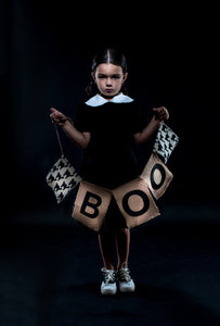 Girl wearing dress, Girl holding "Boo" sign 